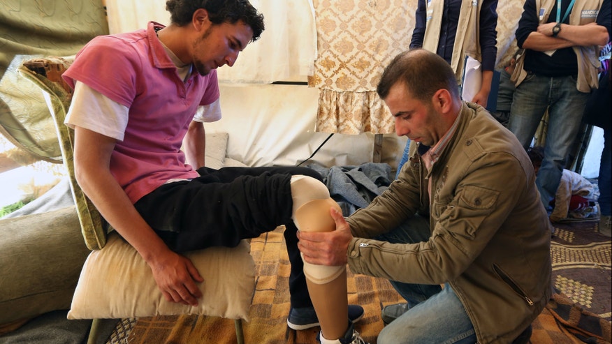 Syrian amputees_AP_Apr 2 2014.jpg